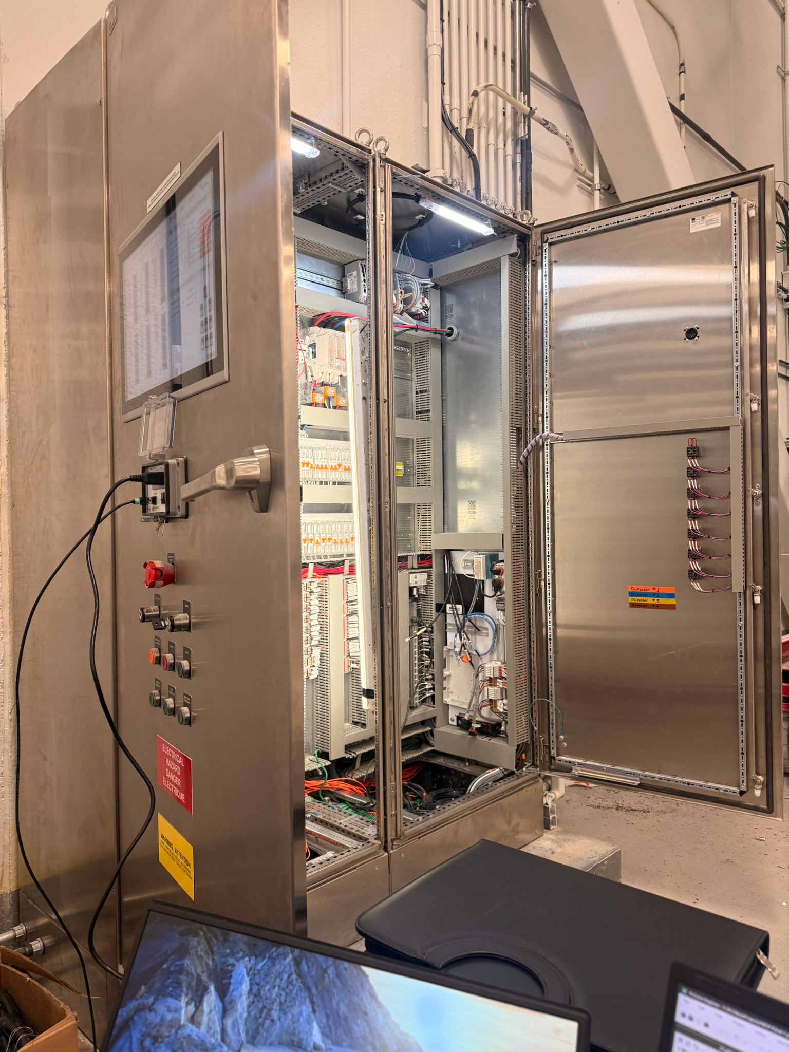 Panel open at angle showing interior components and HMI